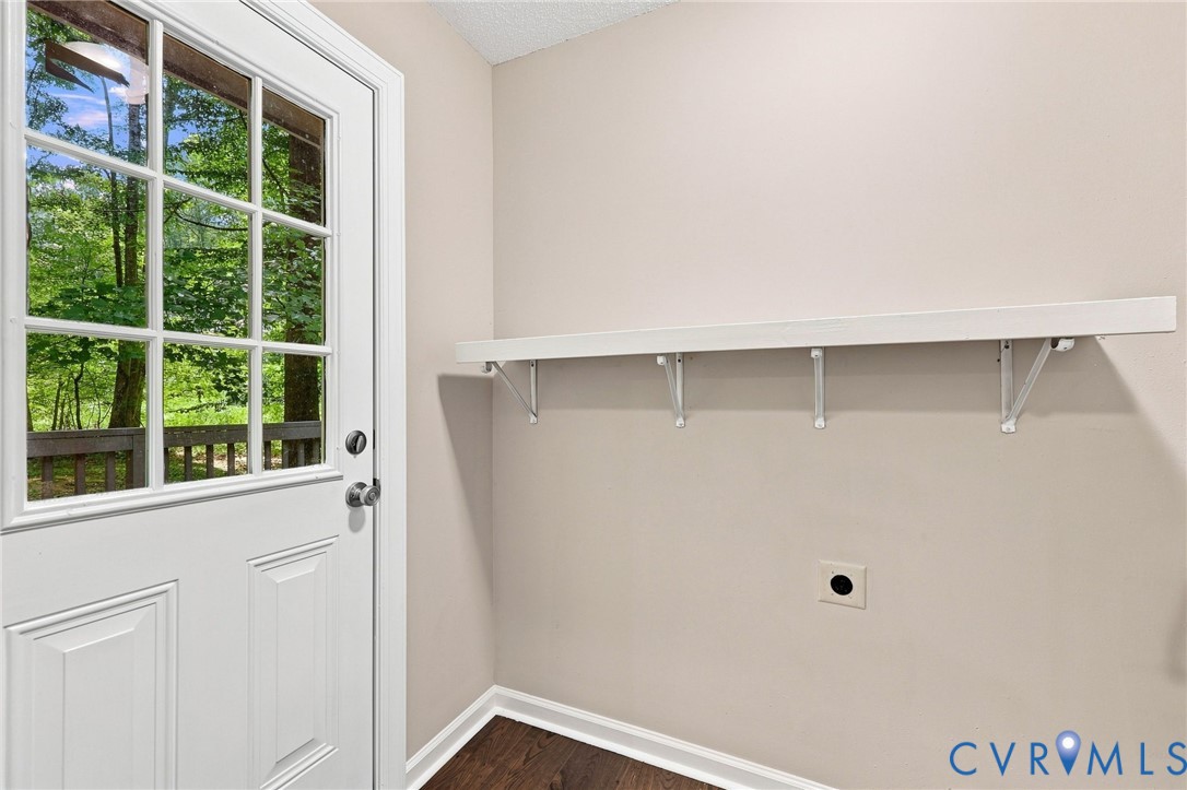 85 Columbia Road Cartersville, VA 23027 - Photo 18 of 26 White paneled door with windowpanes, wood-finish f