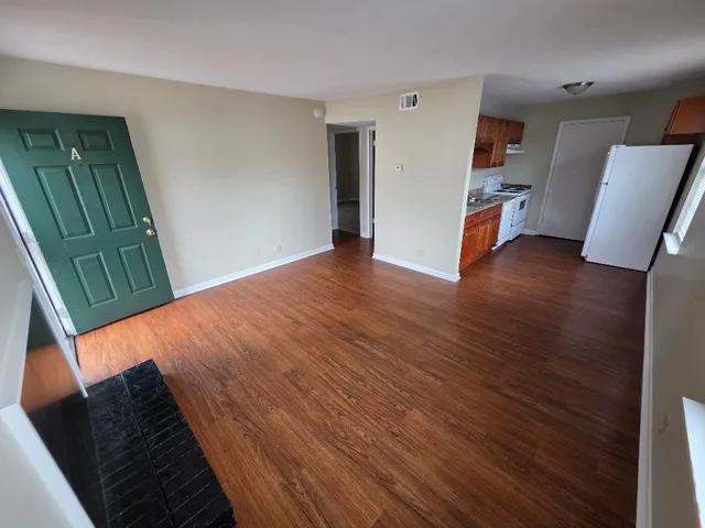 a view of livingroom with furniture and wooden floor