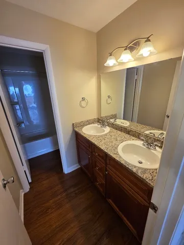 a bathroom with a sink and mirror