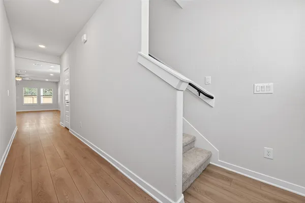 a view of entryway with wooden floor