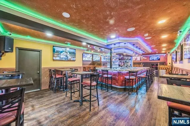 a view of a dining area with furniture and wooden floor