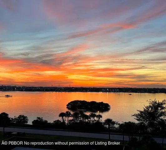 a view of ocean with sunset