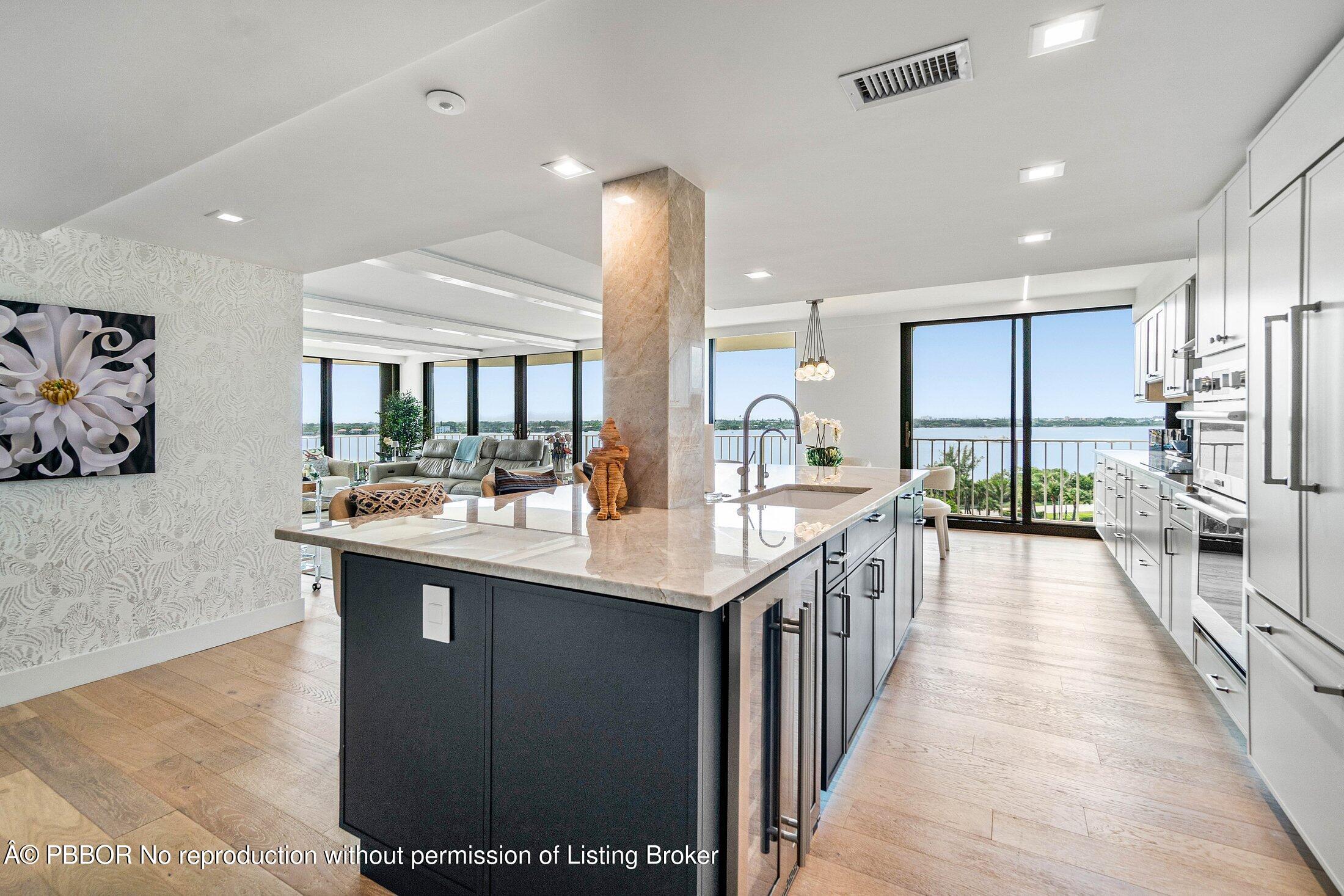 3400 South Ocean Boulevard, Unit 7AII Palm Beach, FL 33480 - Photo 12 of 37 a kitchen with counter top space a sink and cabinets
