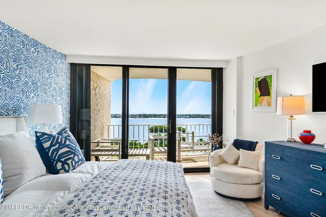 a bedroom with a large bed and walk in closet