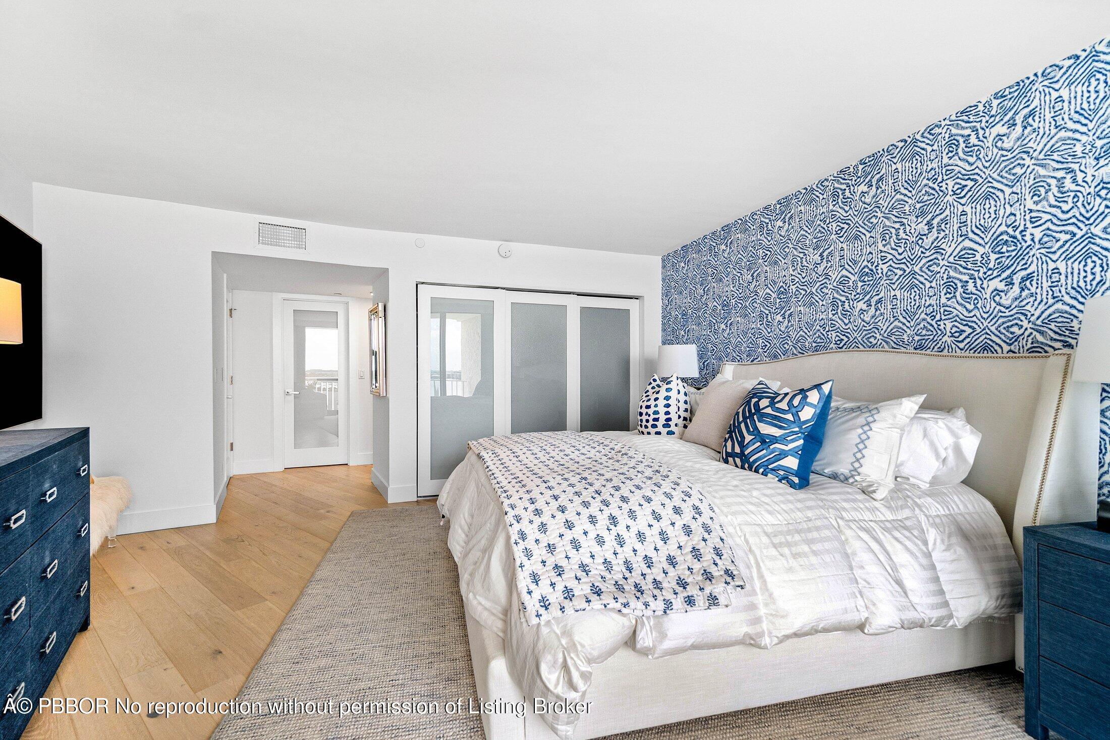 3400 South Ocean Boulevard, Unit 7AII Palm Beach, FL 33480 - Photo 15 of 37 a bedroom with a large bed and walk in closet