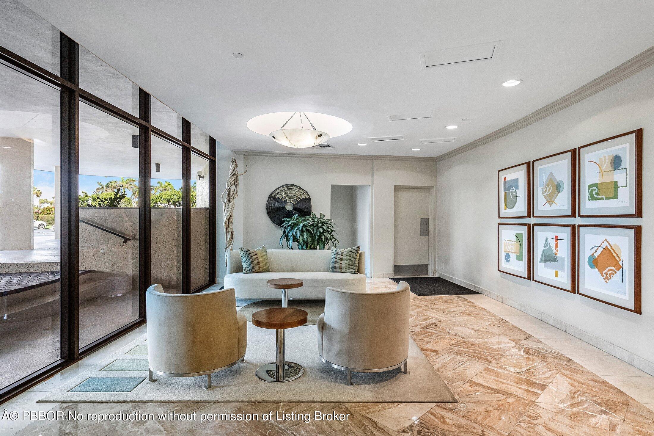 3400 South Ocean Boulevard, Unit 7AII Palm Beach, FL 33480 - Photo 32 of 37 a living room with a large window