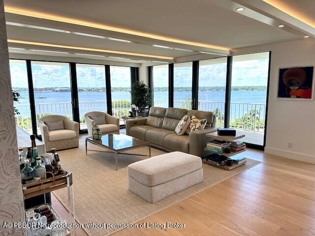 3400 South Ocean Boulevard, Unit 7AII Palm Beach, FL 33480 - Photo 7 of 37 a living room with furniture and a floor to ceiling window