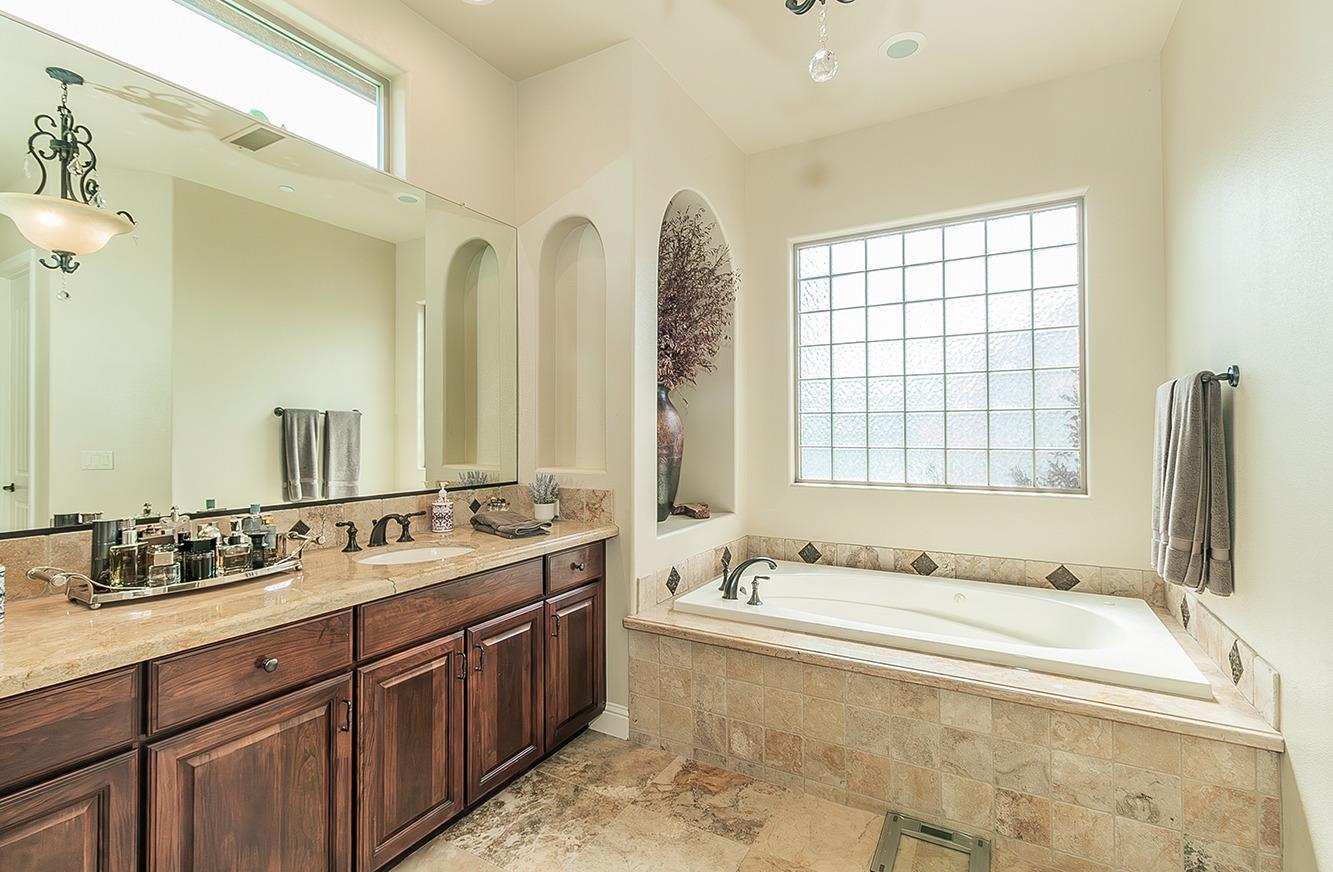 1807 North Rector Avenue Clovis, CA 93619 - Photo 19 of 55 a spacious bathroom with sinks mirror and a bathtub