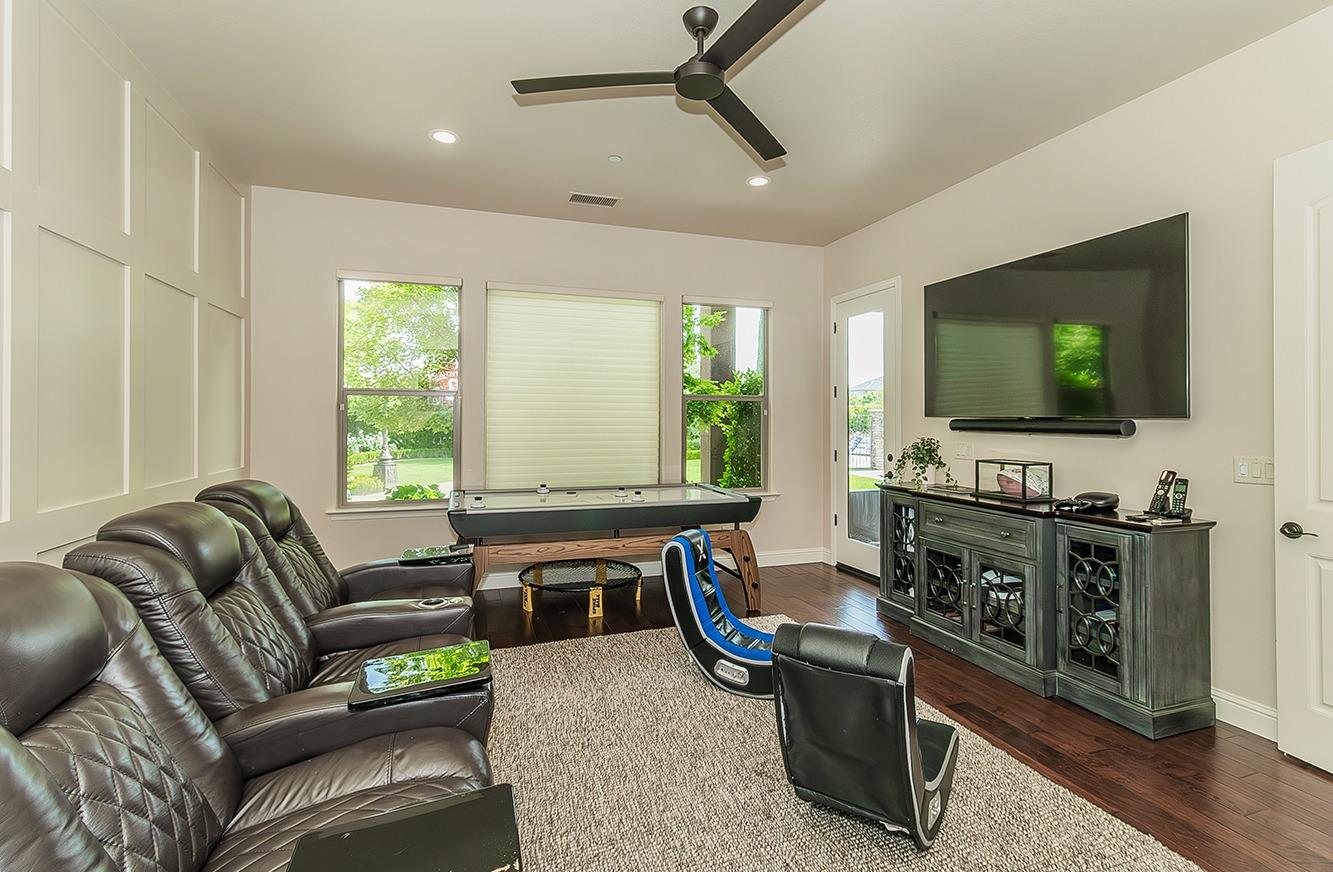 1807 North Rector Avenue Clovis, CA 93619 - Photo 26 of 55 a living room with furniture and a flat screen tv