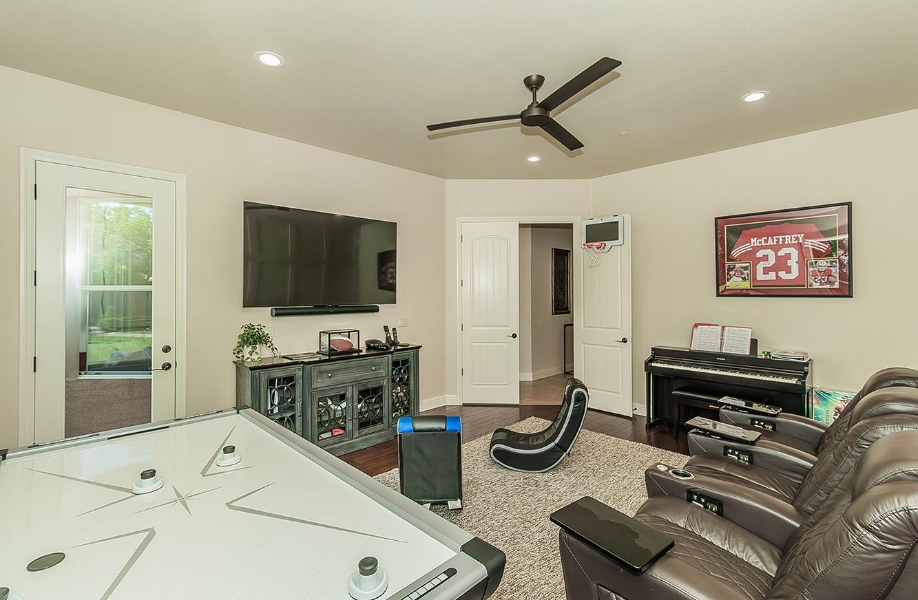 1807 North Rector Avenue Clovis, CA 93619 - Photo 27 of 55 a living room with furniture and a flat screen tv