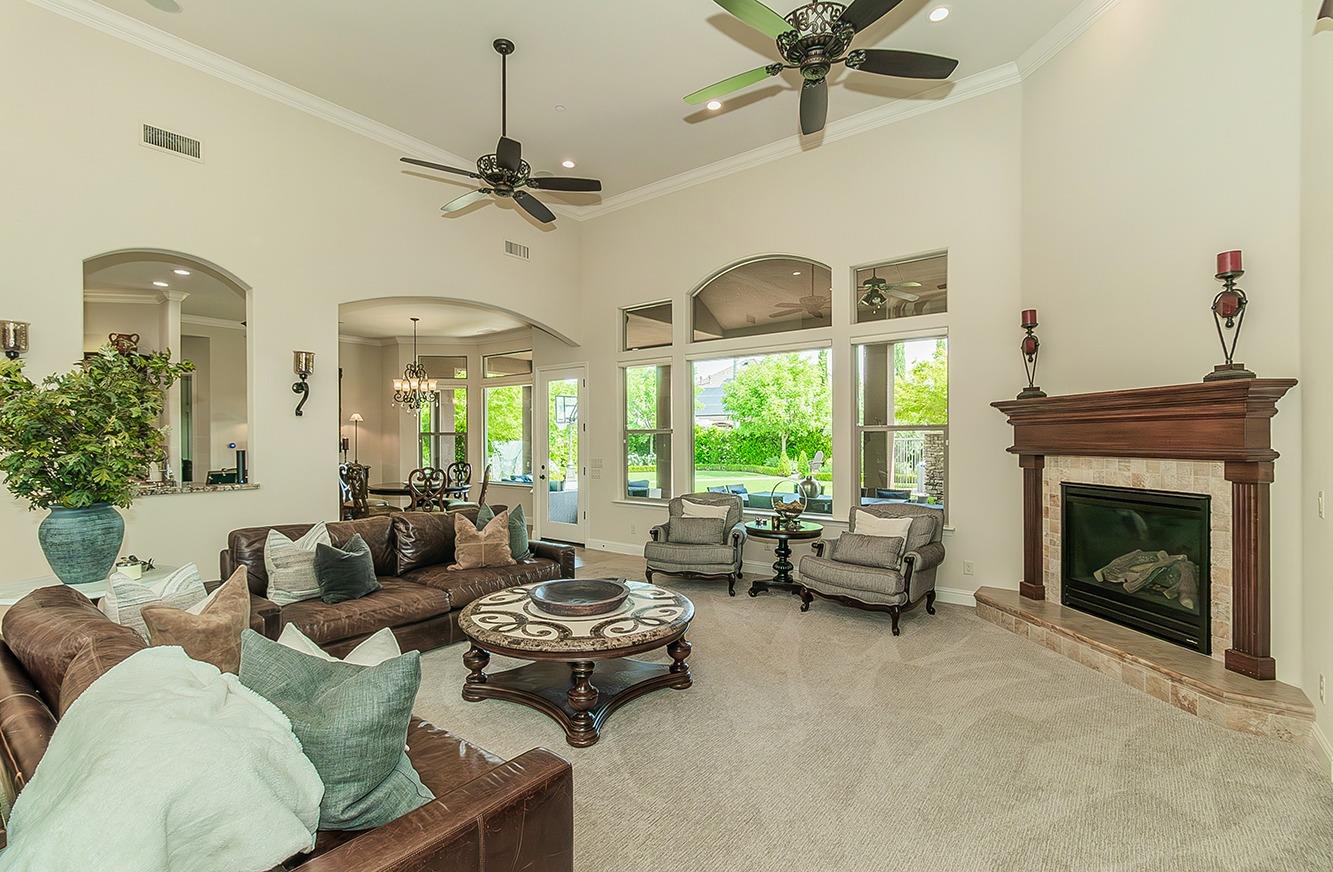 1807 North Rector Avenue Clovis, CA 93619 - Photo 5 of 55 a living room with furniture ceiling fan and a fireplace