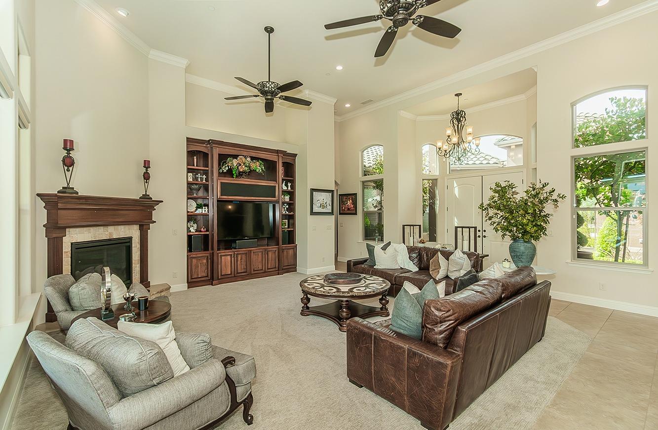 1807 North Rector Avenue Clovis, CA 93619 - Photo 7 of 55 a living room with furniture a fireplace and a chandelier