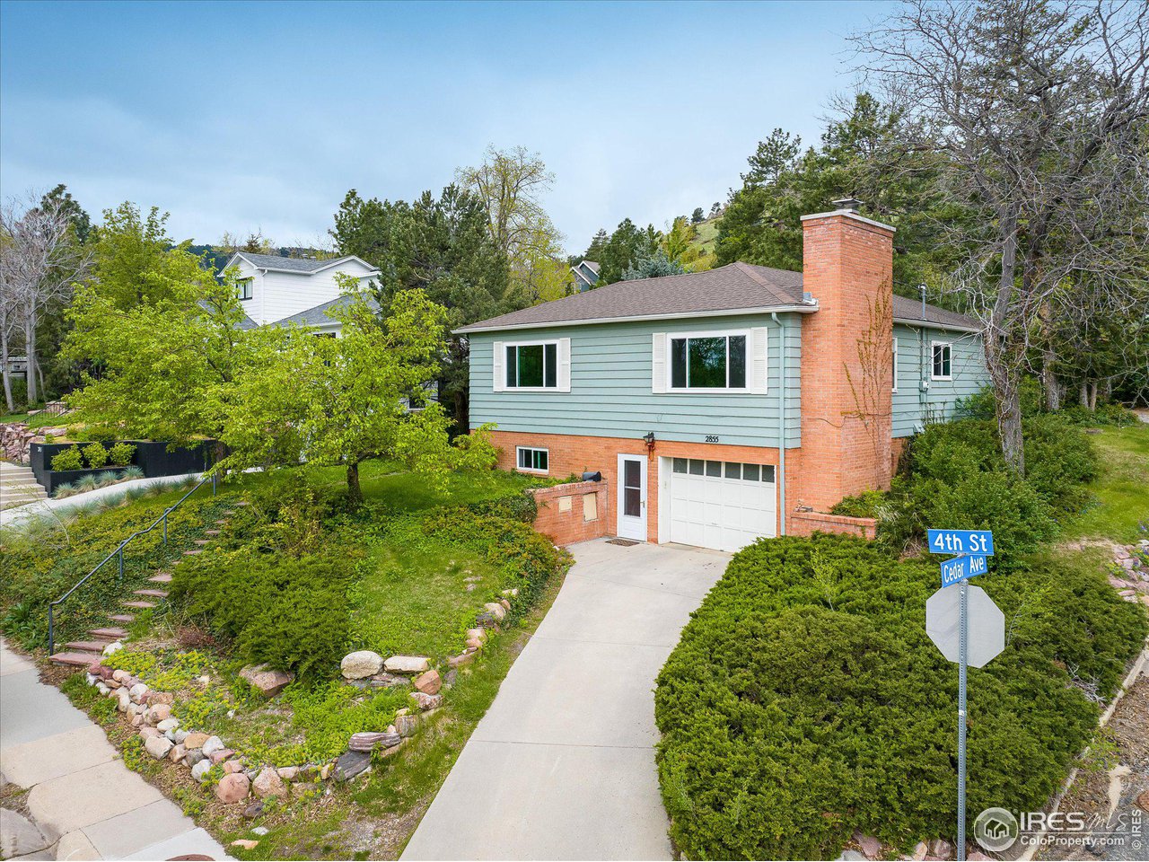 2855 4th Street Boulder, CO 80304 - Photo 1 of 37 a front view of a house with a yard and outdoor seating