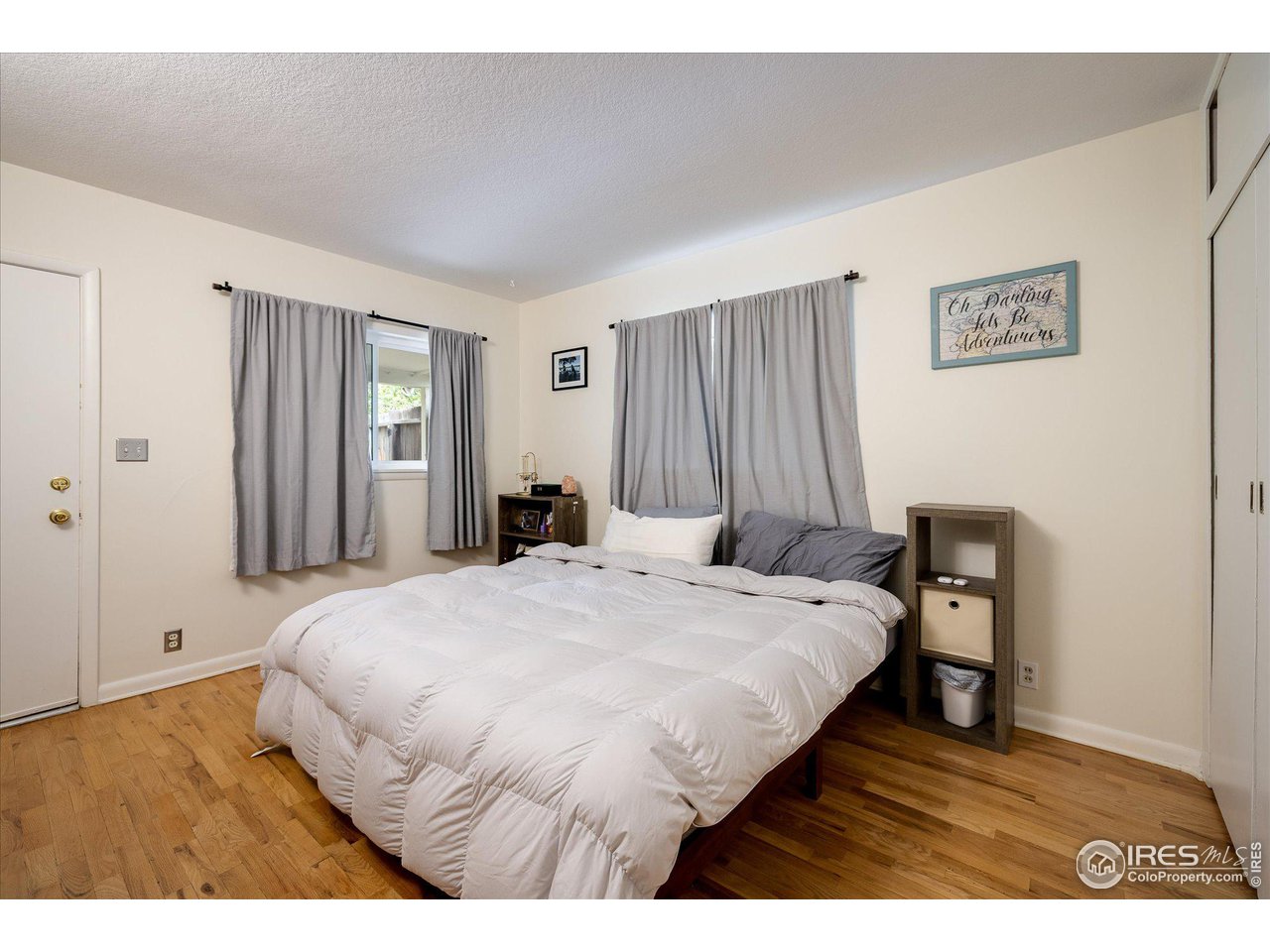 2855 4th Street Boulder, CO 80304 - Photo 11 of 37 a bedroom with a bed and wooden floor