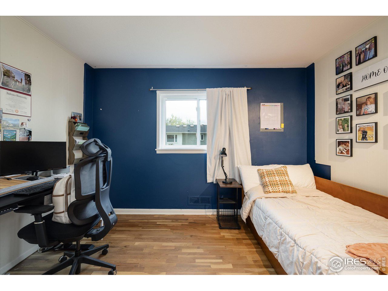 2855 4th Street Boulder, CO 80304 - Photo 13 of 37 a bedroom with a bed and a window
