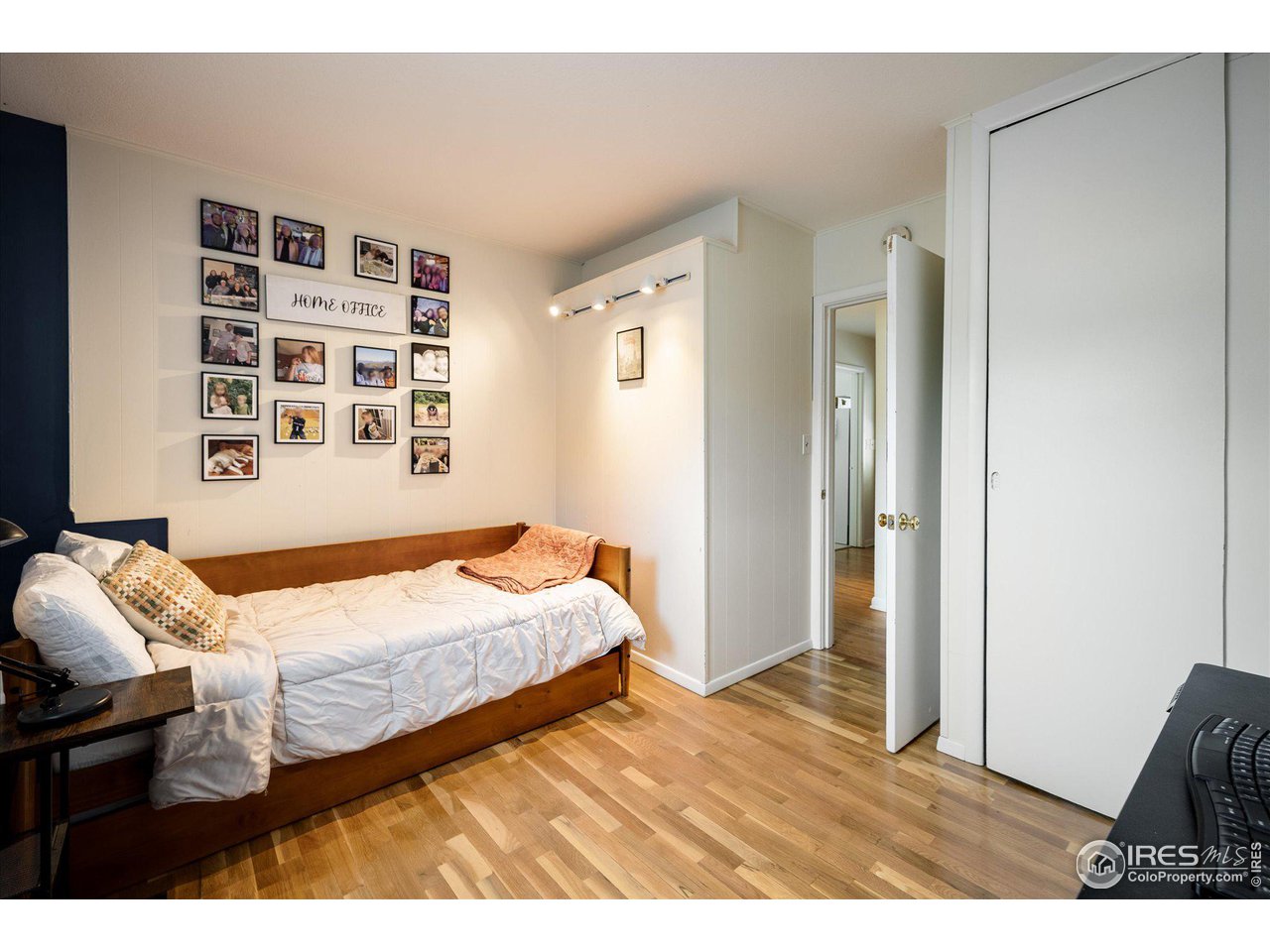 2855 4th Street Boulder, CO 80304 - Photo 14 of 37 a bedroom with a bed a dresser and a large mirror