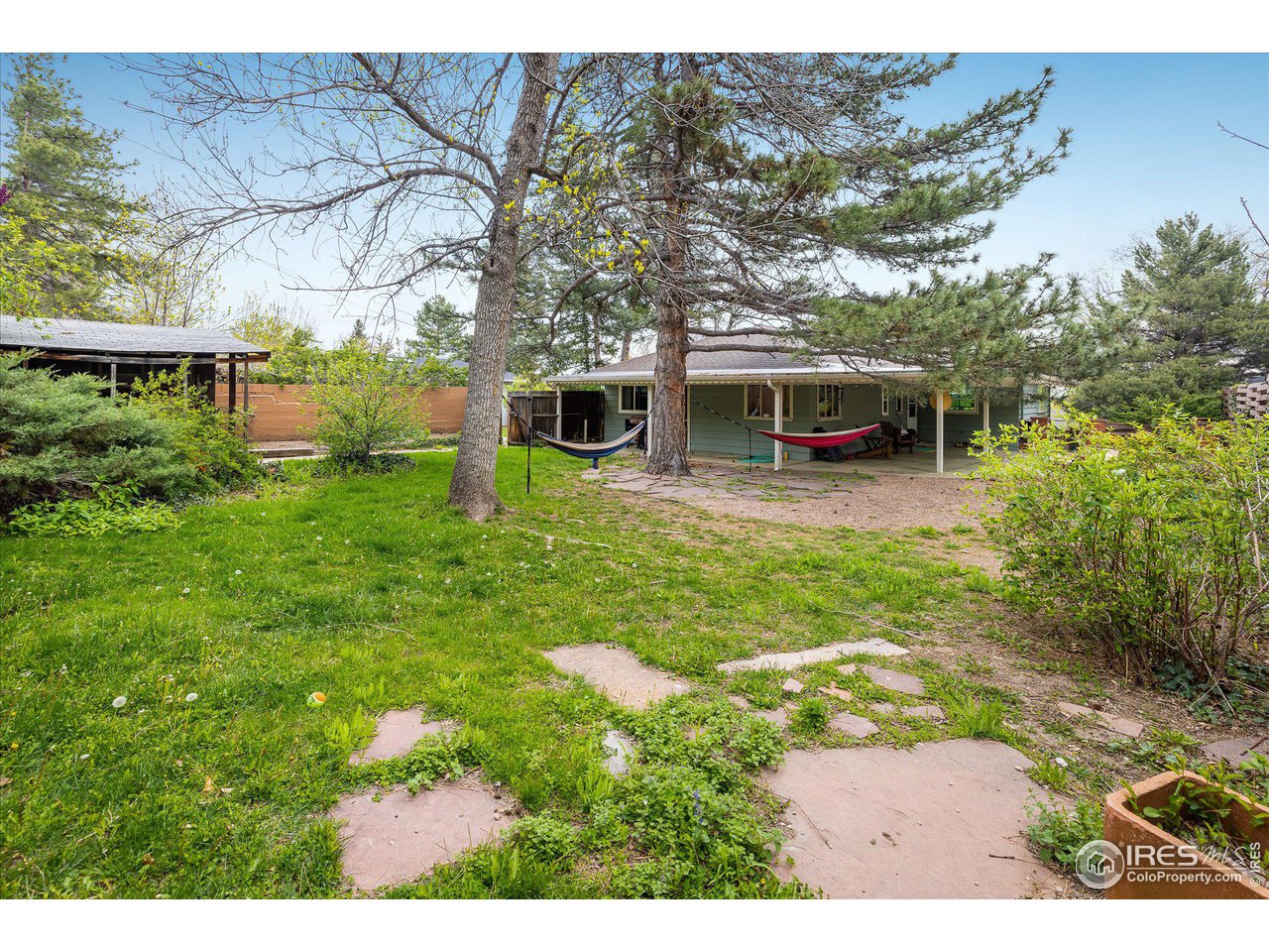 2855 4th Street Boulder, CO 80304 - Photo 24 of 37 a view of a backyard with plants and a patio