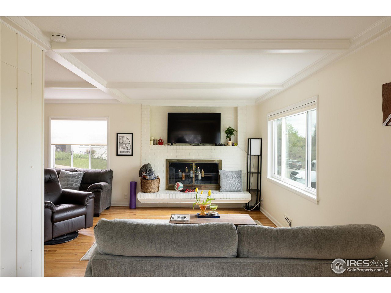 2855 4th Street Boulder, CO 80304 - Photo 6 of 37 a living room with furniture a large window and a fireplace