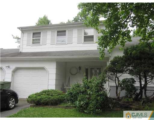221 Normandy Road Edison, NJ 08820 - Photo 1 of 1 a front view of a house with a garden