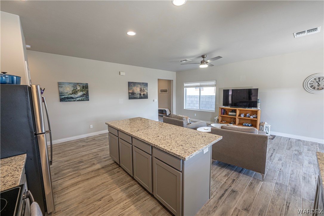 3550 North Kenneth Road Kingman, AZ 86409 - Photo 11 of 41 a living room with stainless steel appliances granite countertop furniture and a refrigerator