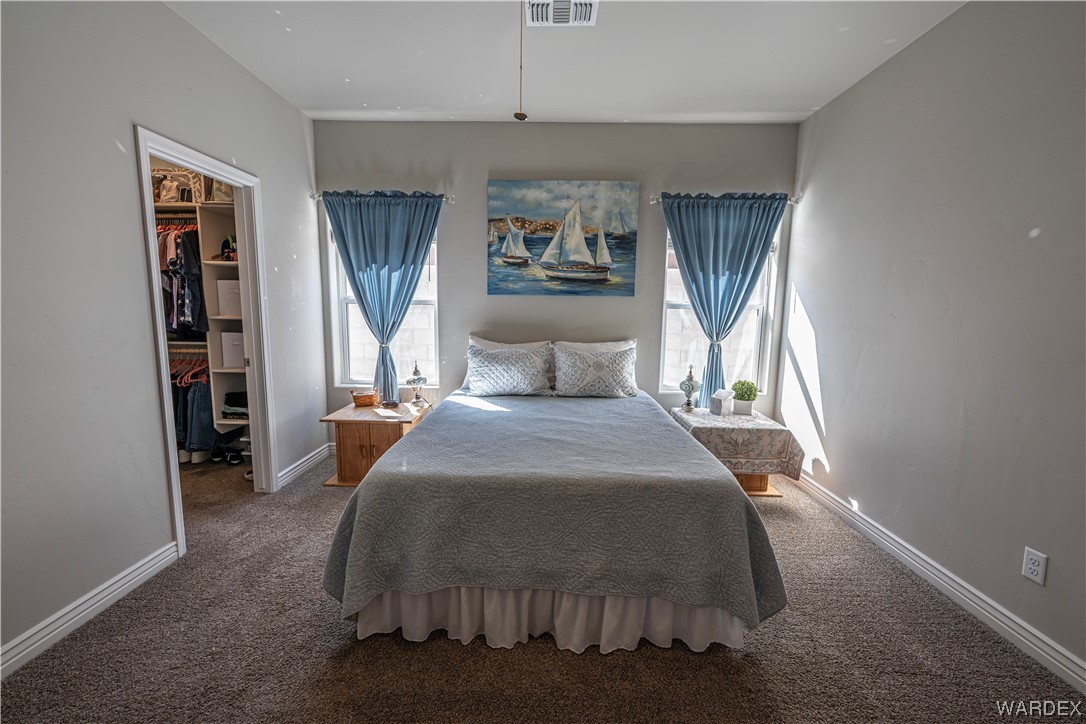3550 North Kenneth Road Kingman, AZ 86409 - Photo 15 of 41 a bedroom with a large bed and a window