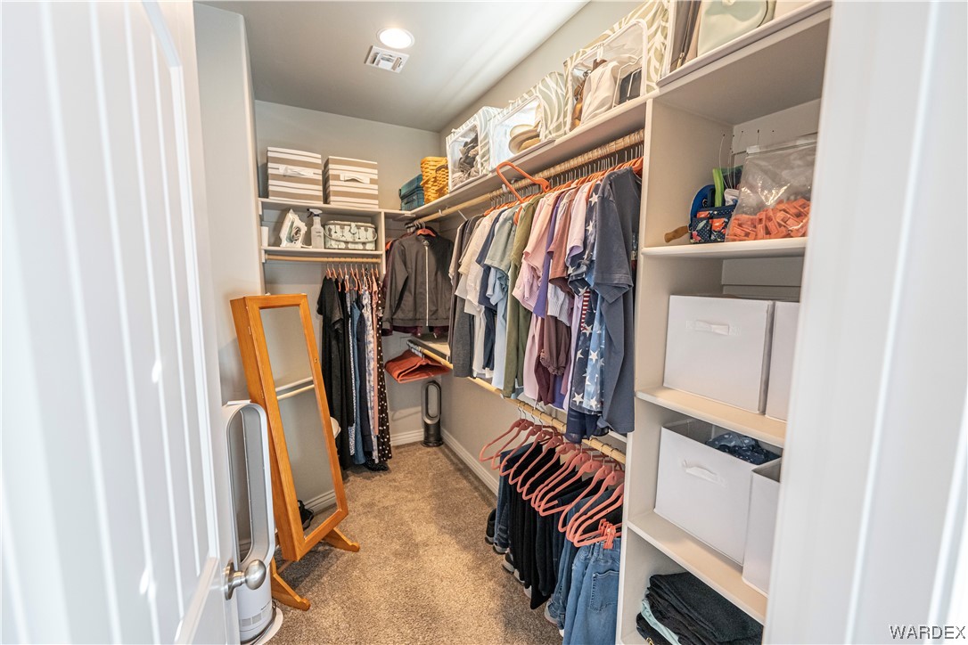 3550 North Kenneth Road Kingman, AZ 86409 - Photo 16 of 41 a view of walk in closet with clothes and shoes