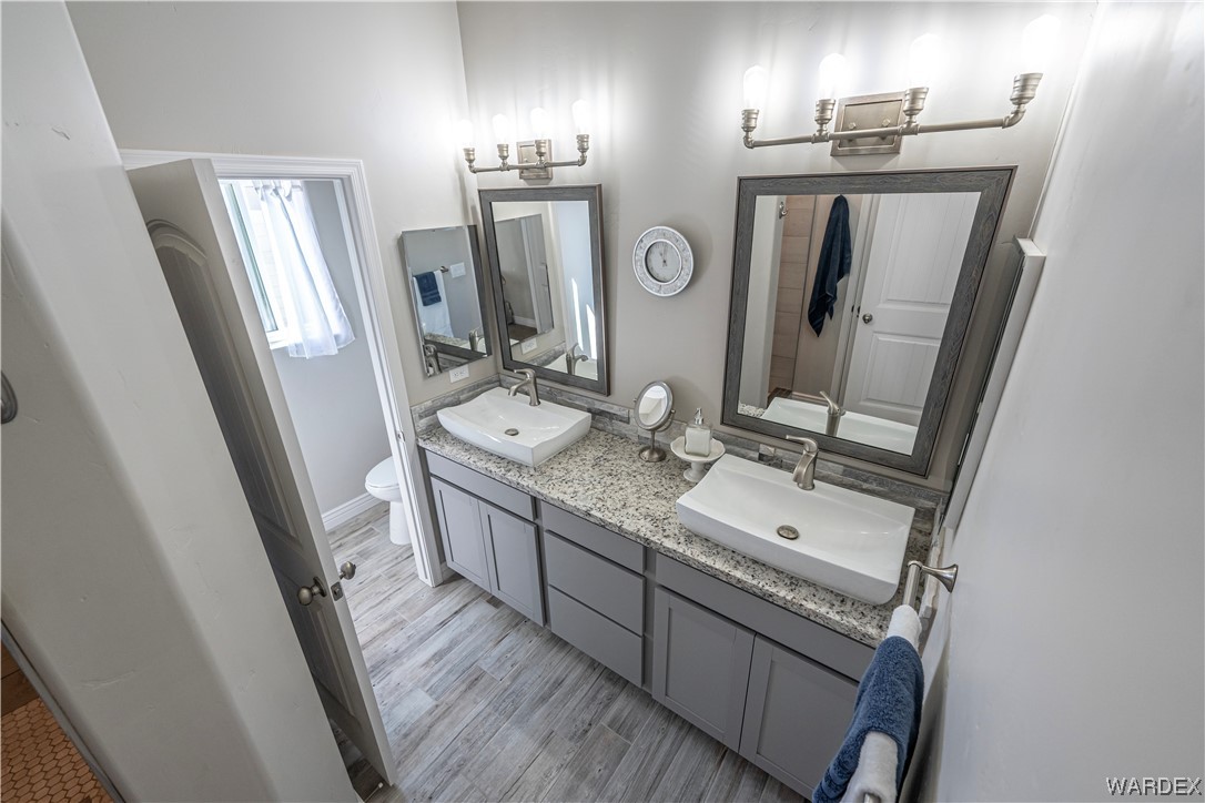 3550 North Kenneth Road Kingman, AZ 86409 - Photo 17 of 41 a bathroom with double vanity sink and mirror