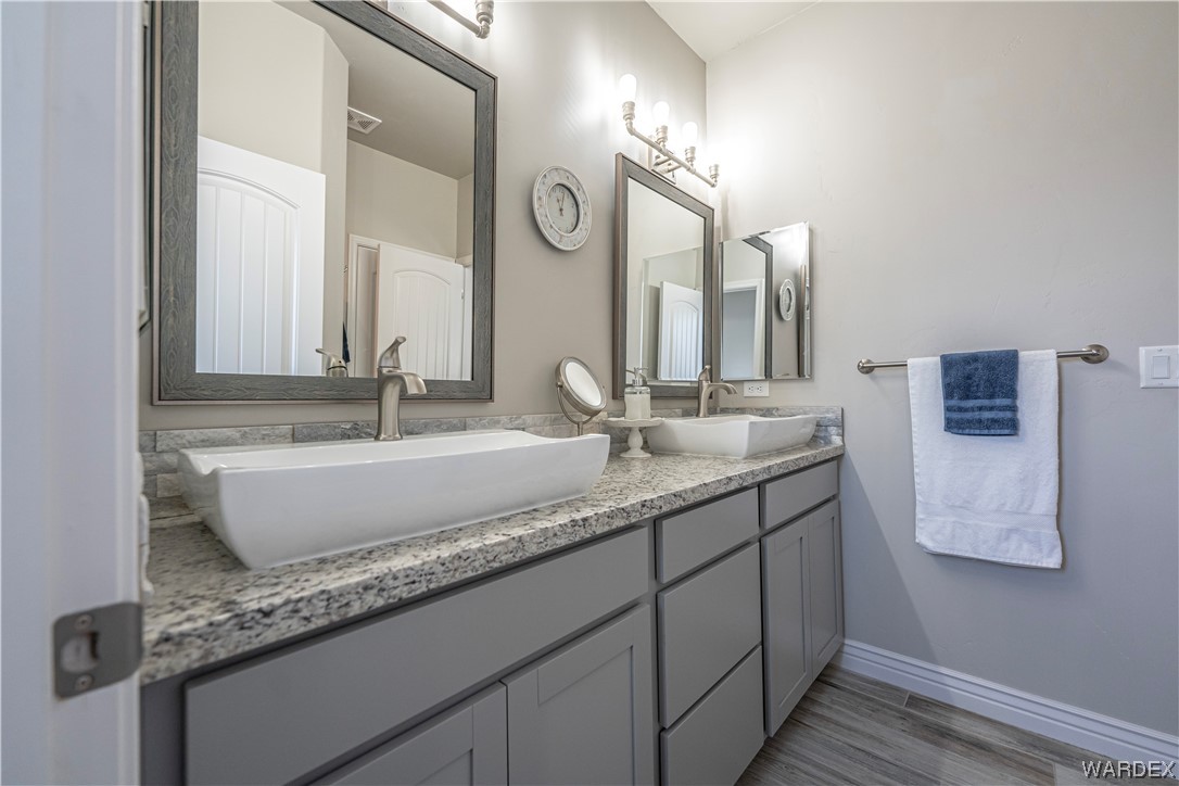 3550 North Kenneth Road Kingman, AZ 86409 - Photo 18 of 41 a bathroom with a double vanity sink and a mirror