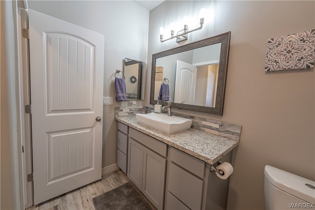 3550 North Kenneth Road Kingman, AZ 86409 - Photo 22 of 41 a bathroom with a granite countertop sink and a mirror