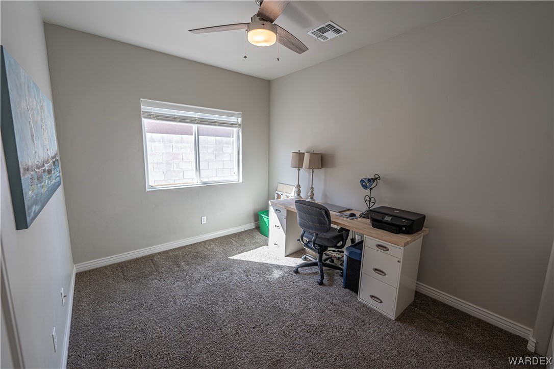 3550 North Kenneth Road Kingman, AZ 86409 - Photo 26 of 41 a view of a workspace with furniture and a window