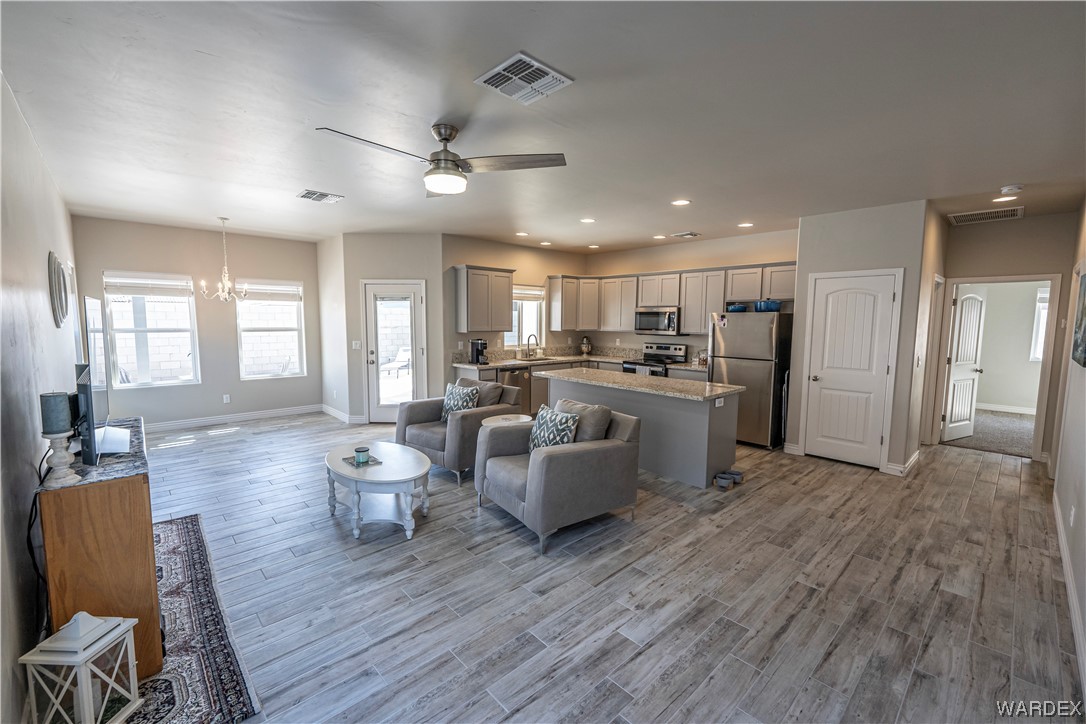 3550 North Kenneth Road Kingman, AZ 86409 - Photo 6 of 41 a living room with furniture and kitchen view
