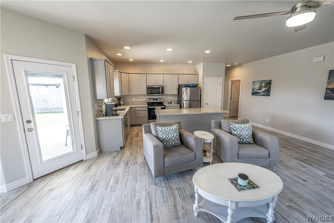 3550 North Kenneth Road Kingman, AZ 86409 - Photo 7 of 41 a living room with furniture and a wooden floor
