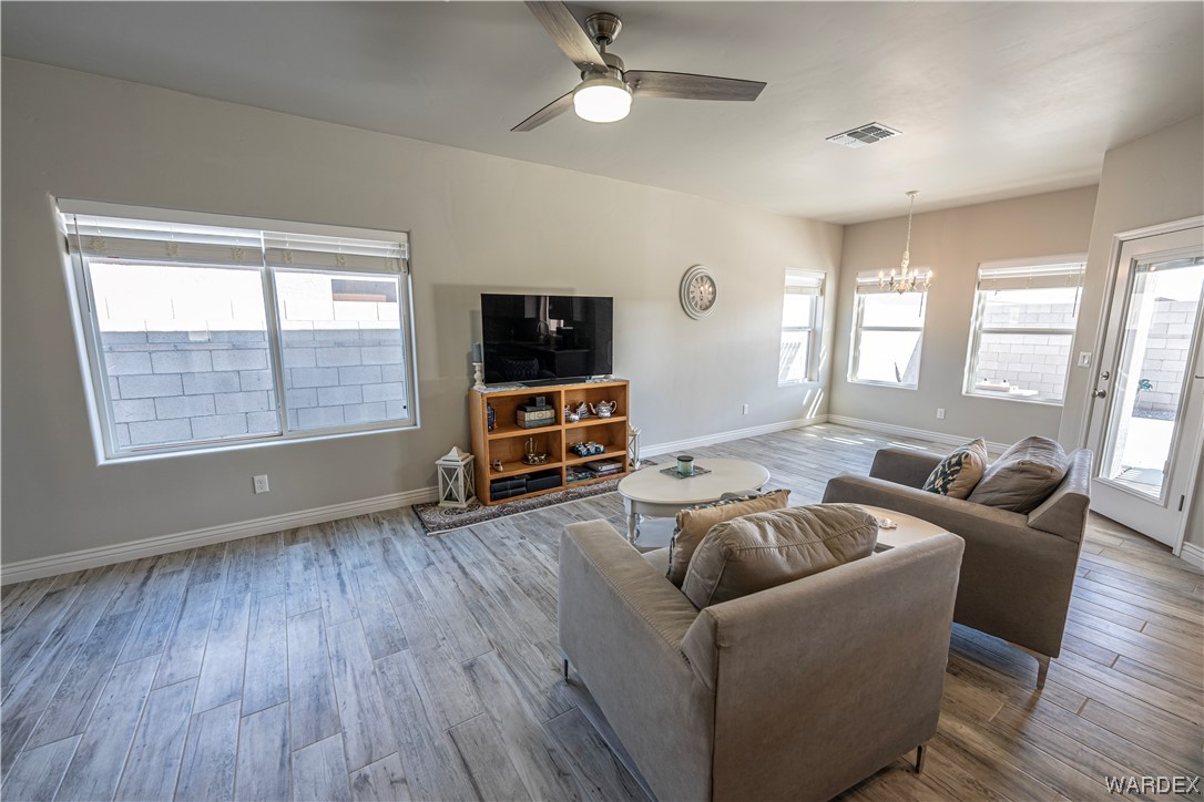 3550 North Kenneth Road Kingman, AZ 86409 - Photo 9 of 41 a living room with furniture and a flat screen tv
