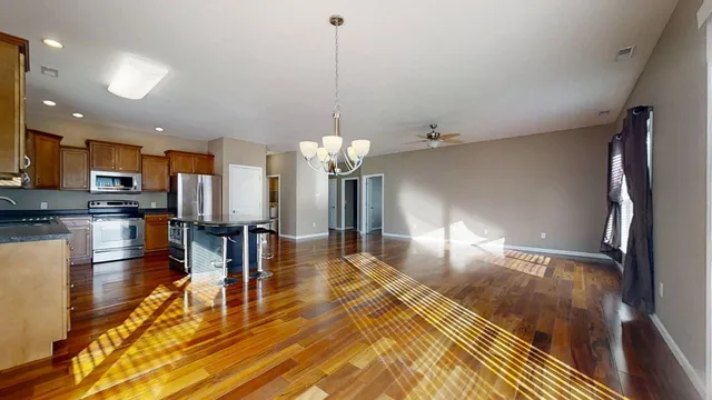 a view of a living room and kitchen