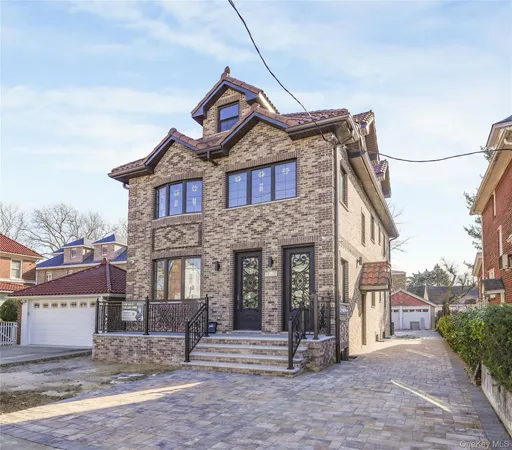 a front view of a house with a garden