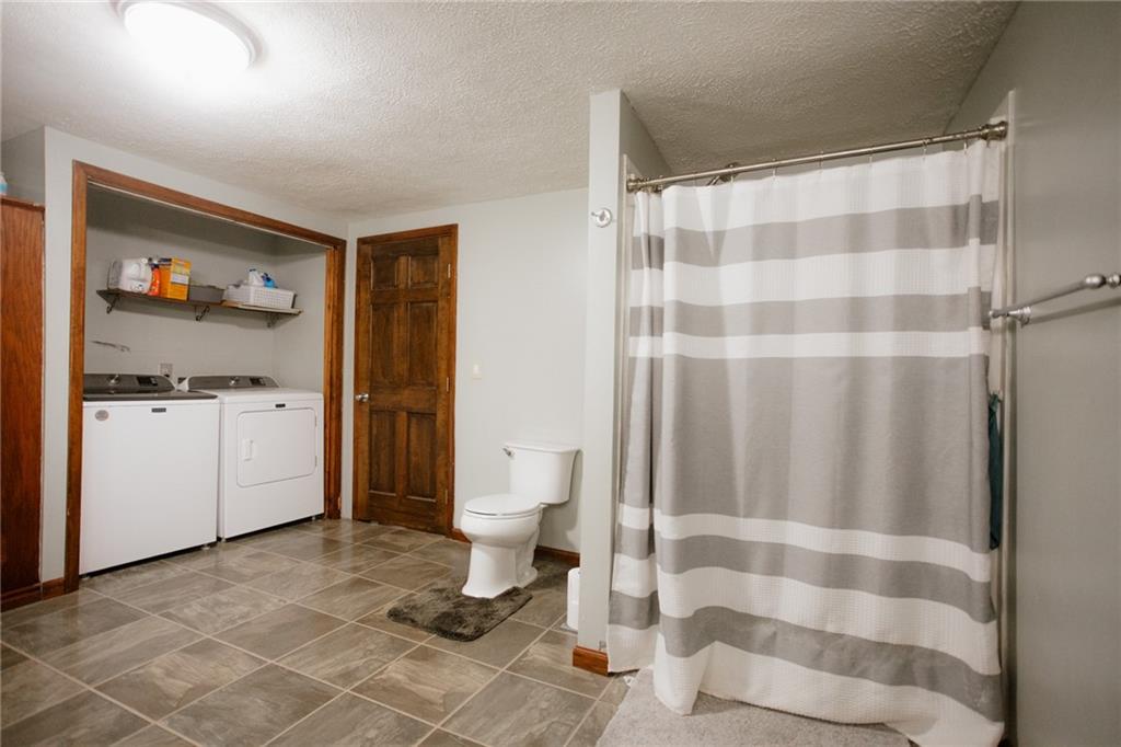 1425 Old State Road New Castle, PA 16101 - Photo 11 of 37 The home’s single-level design ensures effortless everyday living. First-floor laundry adds practicality to the home’s thoughtful floor plan.