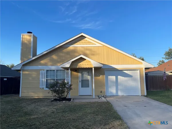 a front view of a house with yard