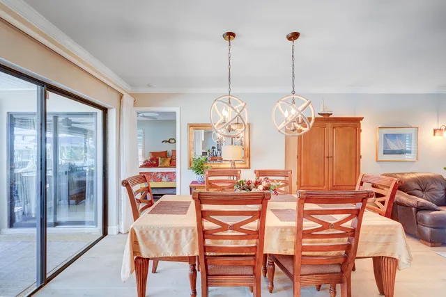 a bedroom with two beds and a book shelf