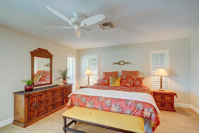 a view of a house with a swimming pool and a yard