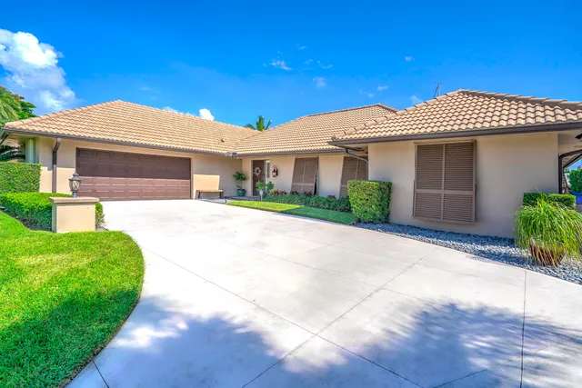 a living room with furniture and a lamp