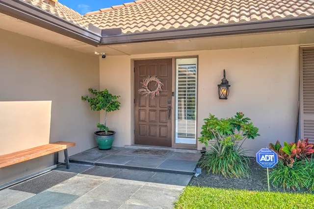 a view of a dining room with furniture wooden floor and chandelier