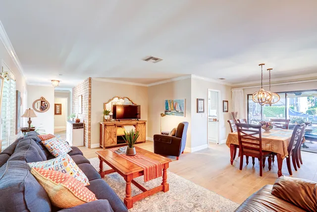 a kitchen with appliances a sink and cabinets