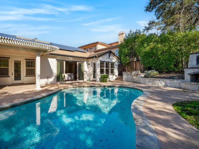 a view of a house with swimming pool