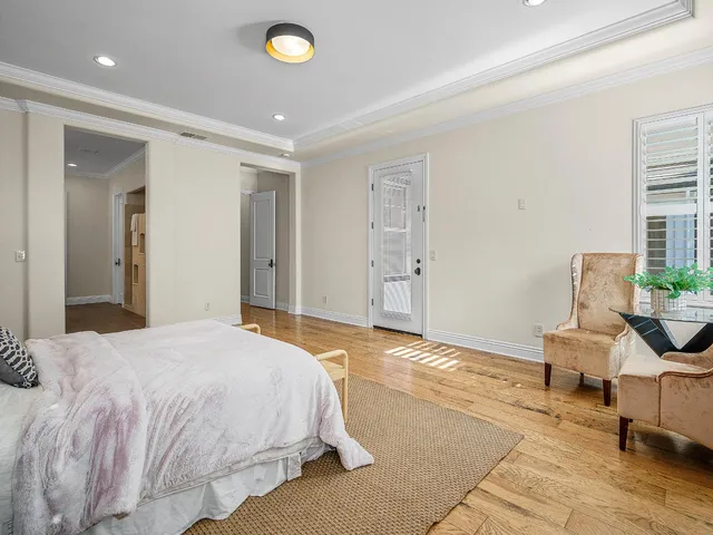a bathroom with a tub a sink and a large mirror