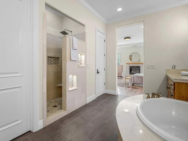 a view of a livingroom with furniture and staircase