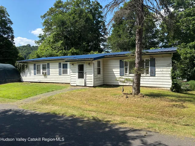 a house view with swimming pool