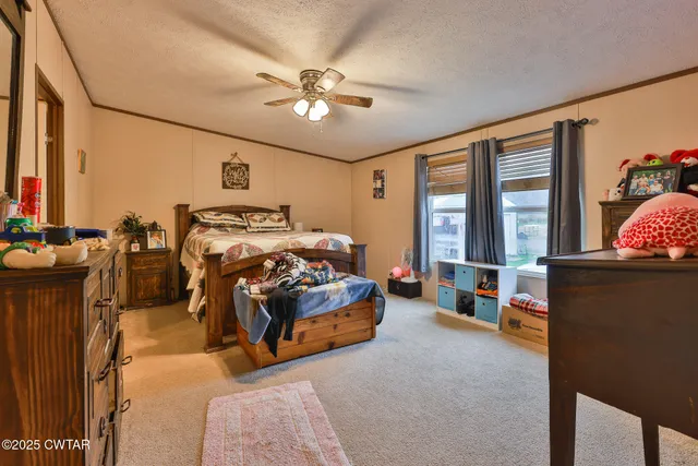 a bathroom with a sink mirror and a shower