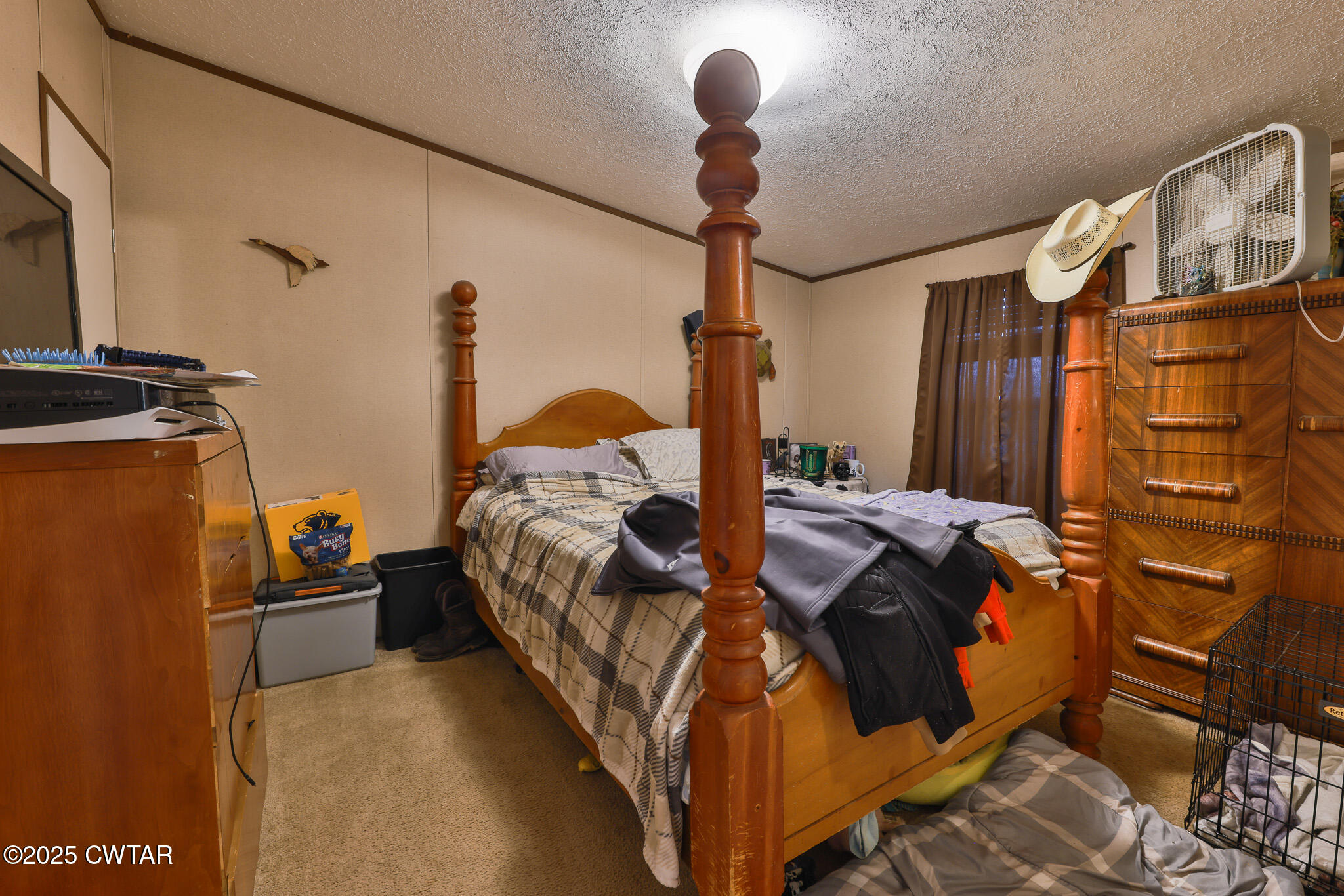 4532 Old State Rte 22 Gleason, TN 38229 - Photo 19 of 34 a bedroom with a bed and a chandelier