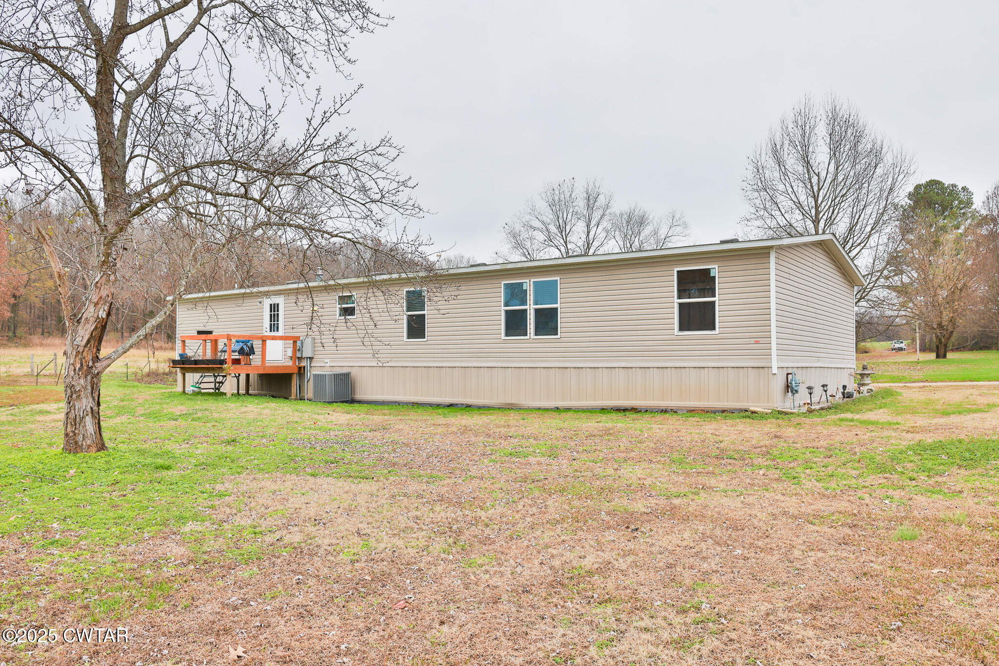 4532 Old State Rte 22 Gleason, TN 38229 - Photo 21 of 34 a backyard of a house with table and chairs