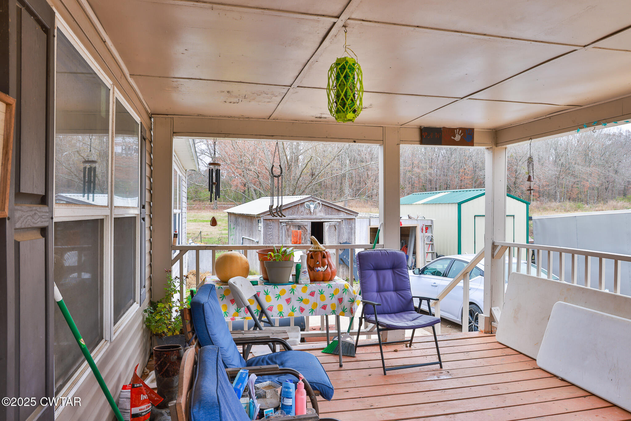 4532 Old State Rte 22 Gleason, TN 38229 - Photo 7 of 34 a dining room with furniture a rug potted plants and wooden floor